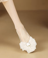Zapatos planos negros de moda para mujer con lazo.